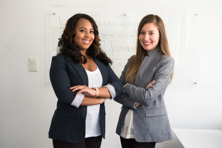image of two women who are virtual real estate office receptionists