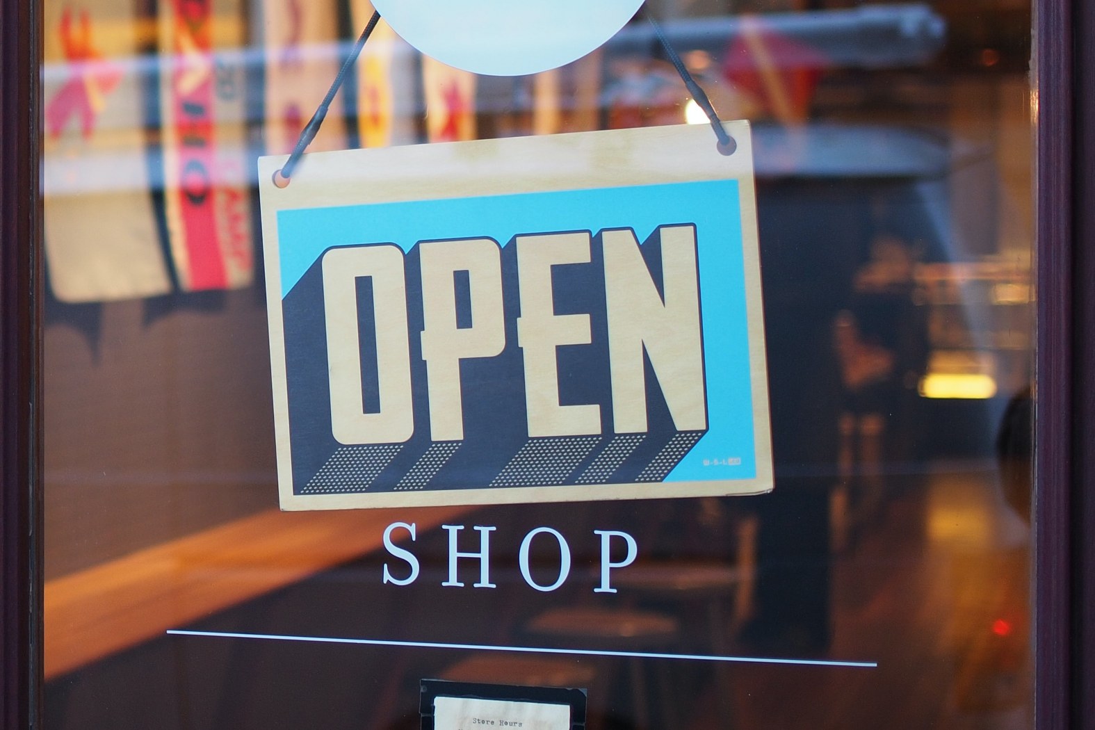 image of an open sign symbolizing seasonal business and the need for a live virtual receptionist