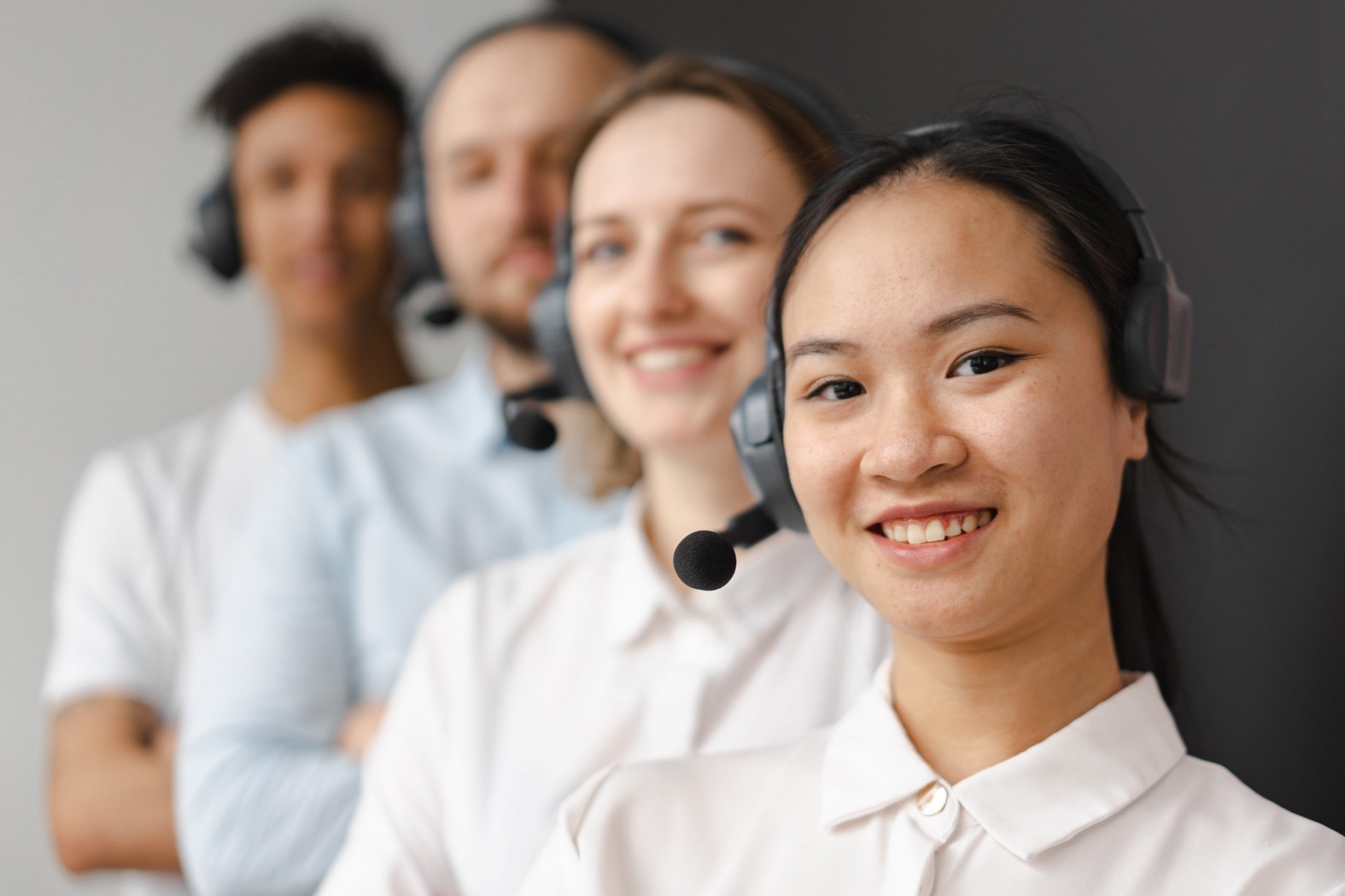 images of 4 people representing Call receptionist excellence with virtual receptionists